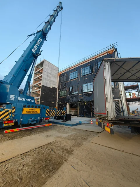 Crane lifting materials at an industrial site